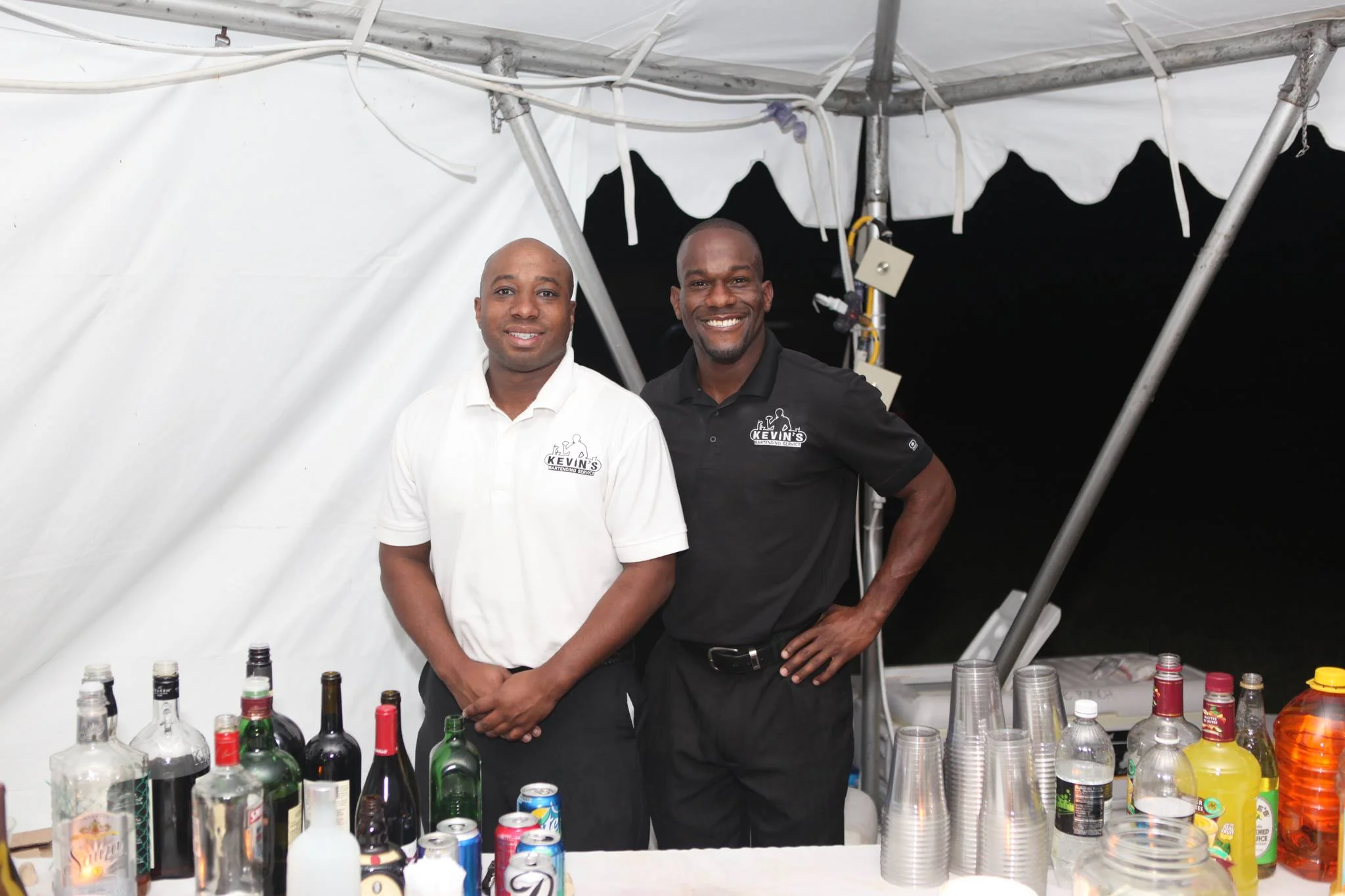 KBS professional barback restocking supplies and ice behind the bar