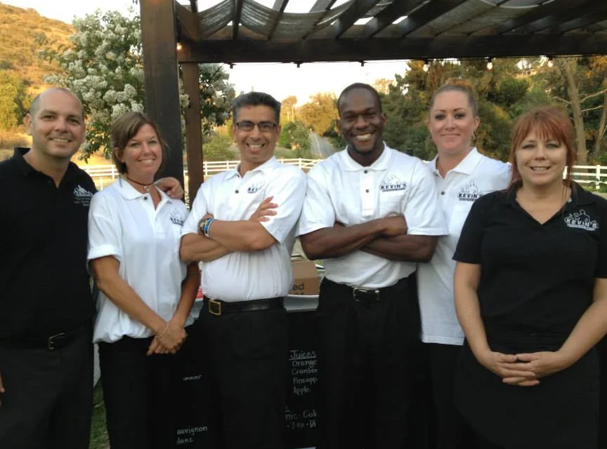 Professional KBS event waitstaff serving food at a Southern California event